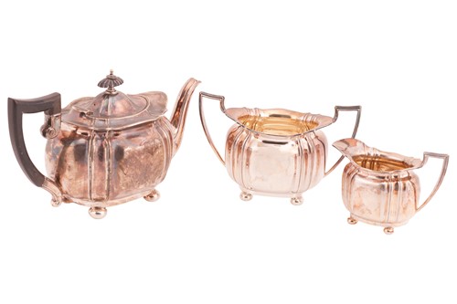 Lot An Edwardian three-piece tea service, fluted...
