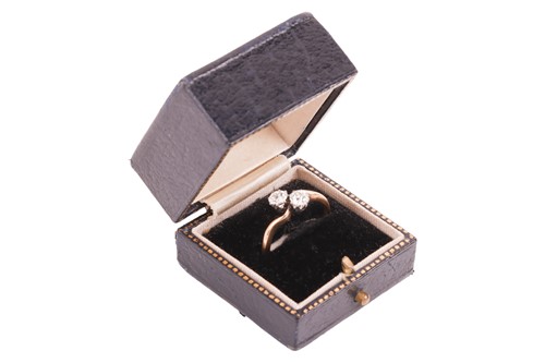 Lot An old-cut diamond Toi-et-Moi ring, with a...