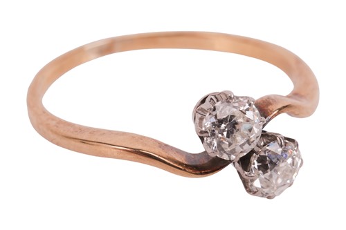 Lot An old-cut diamond Toi-et-Moi ring, with a...