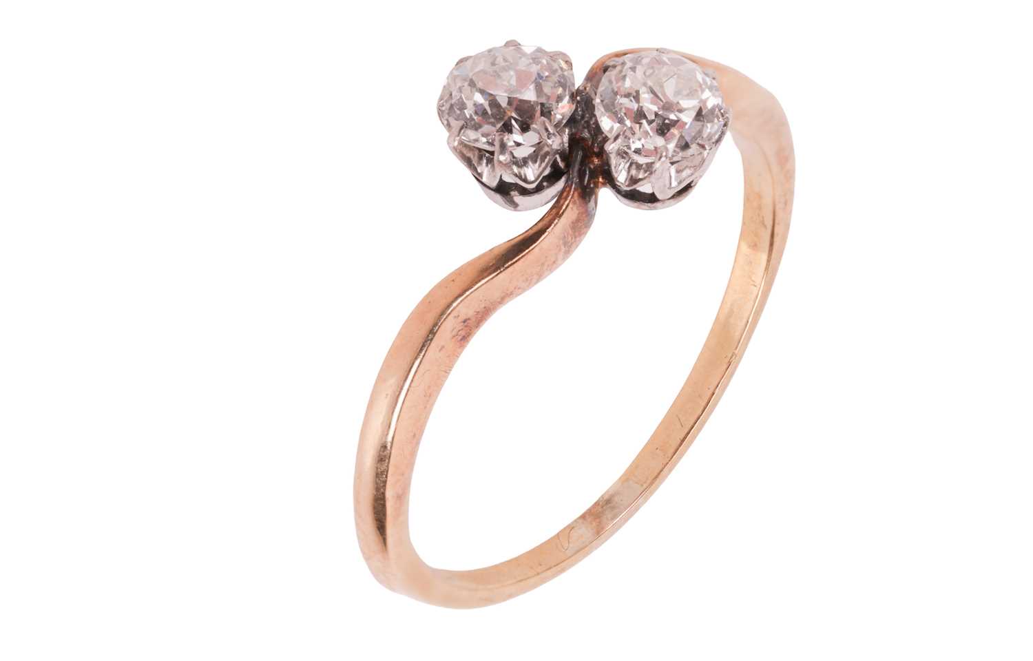 Lot An old-cut diamond Toi-et-Moi ring, with a...