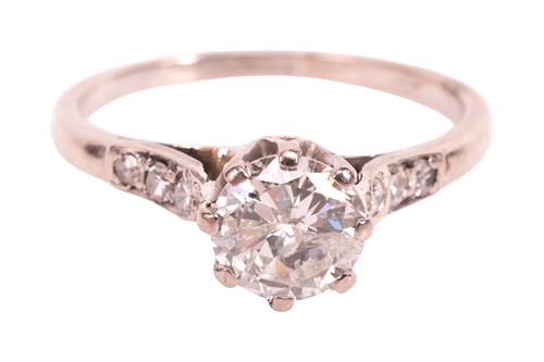 Lot A diamond solitaire ring, featuring a central...