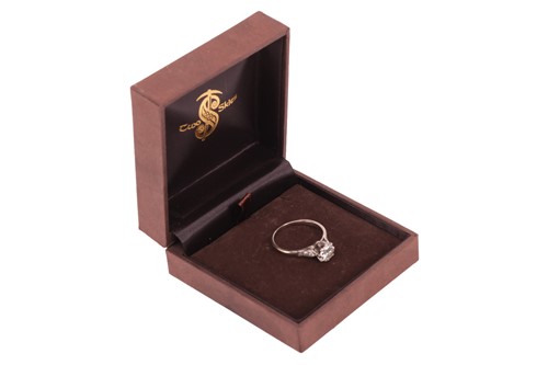 Lot A diamond solitaire ring, featuring a central...