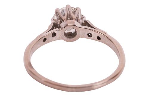 Lot A diamond solitaire ring, featuring a central...