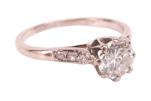 Lot A diamond solitaire ring, featuring a central...