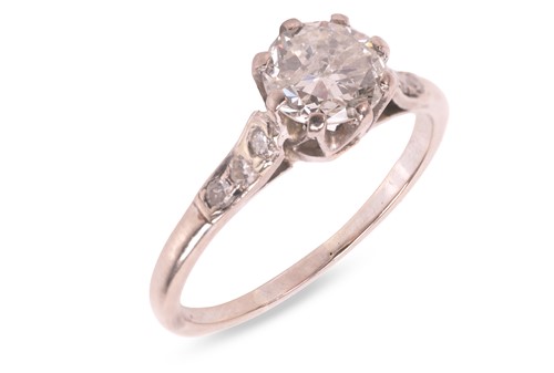 Lot A diamond solitaire ring, featuring a central...
