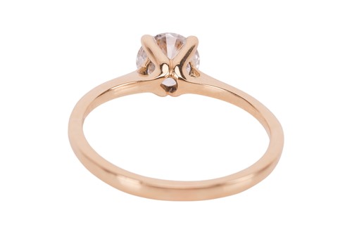 Lot A diamond solitaire ring, featuring a central...