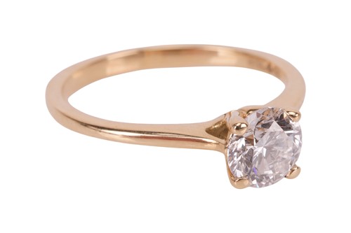 Lot A diamond solitaire ring, featuring a central...