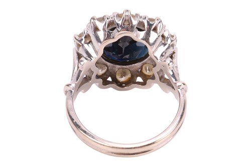 Lot A sapphire and diamond cluster ring, centred...