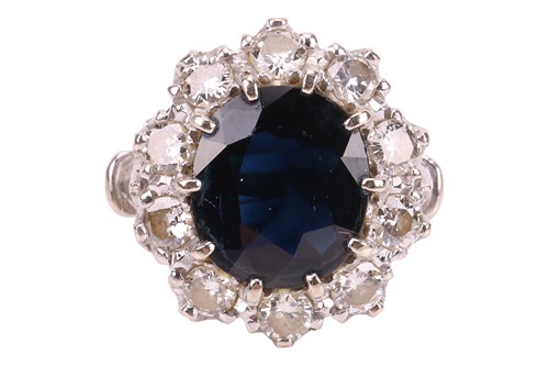 Lot A sapphire and diamond cluster ring, centred...