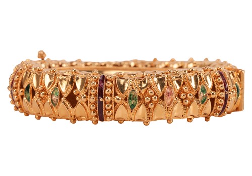 Lot An enamelled bangle, the hinged bangle with...
