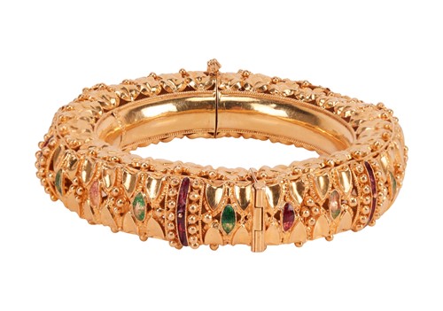 Lot An enamelled bangle, the hinged bangle with...