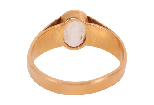 Lot A yellow sapphire ring, the oval-cut yellow...