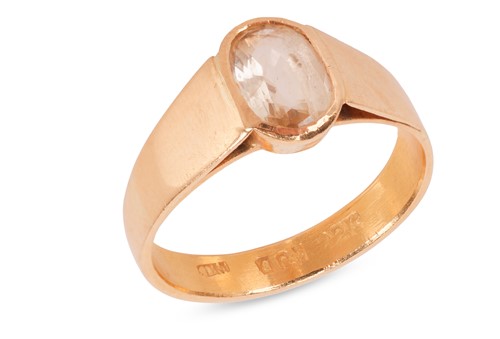 Lot A yellow sapphire ring, the oval-cut yellow...