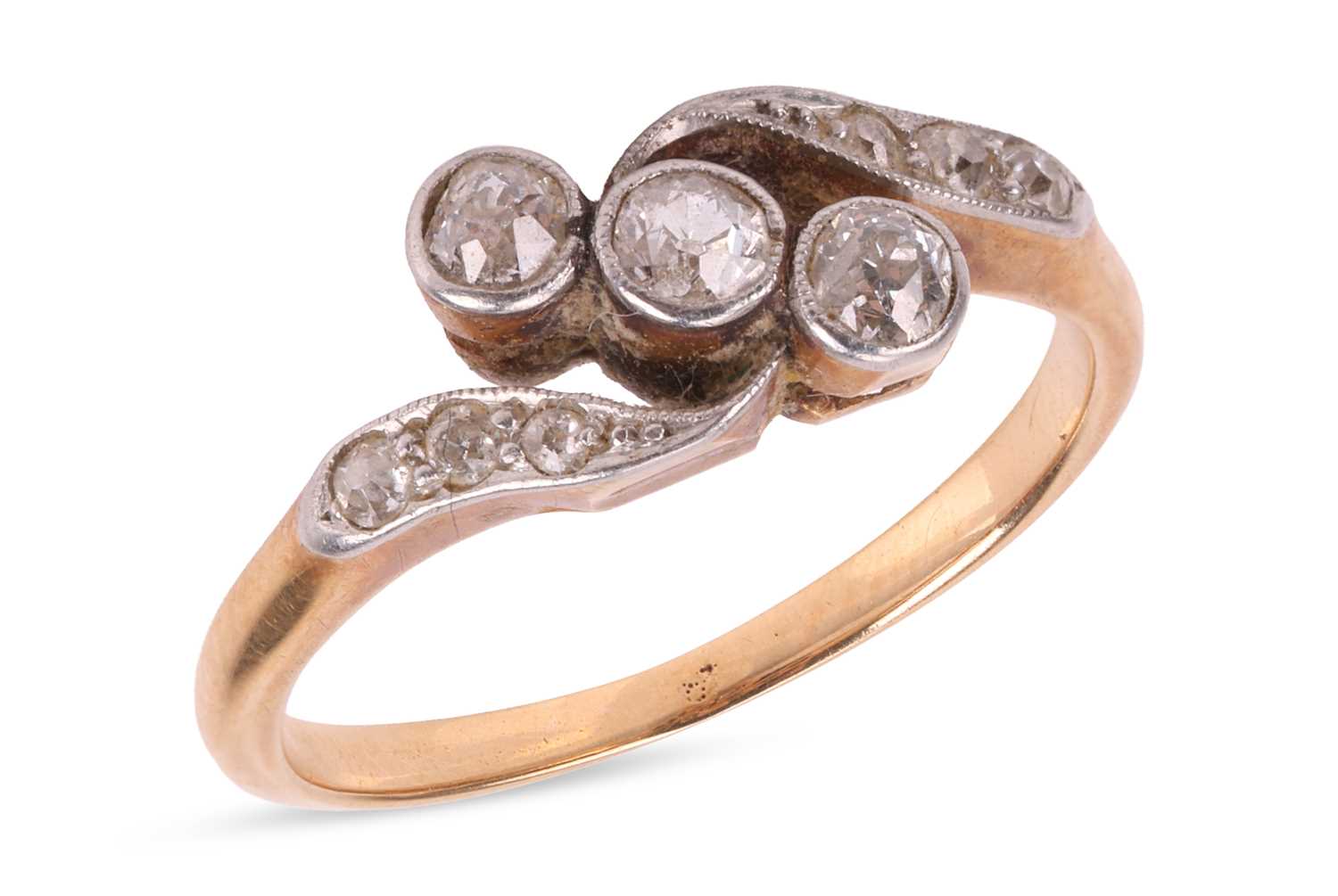 Lot An early 20th century diamond crossover ring,...