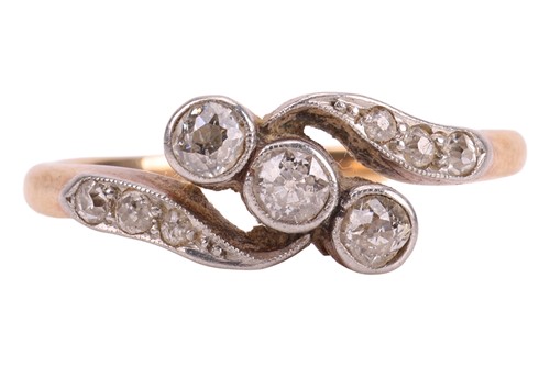 Lot An early 20th century diamond crossover ring,...