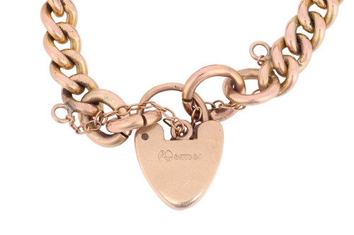 Lot A 9ct gold charm bracelet, the curb link chain...