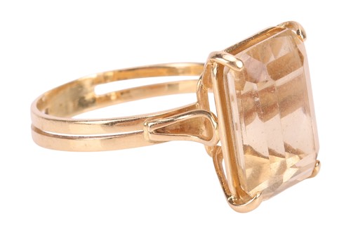 Lot A citrine dress ring, claw-set with a...