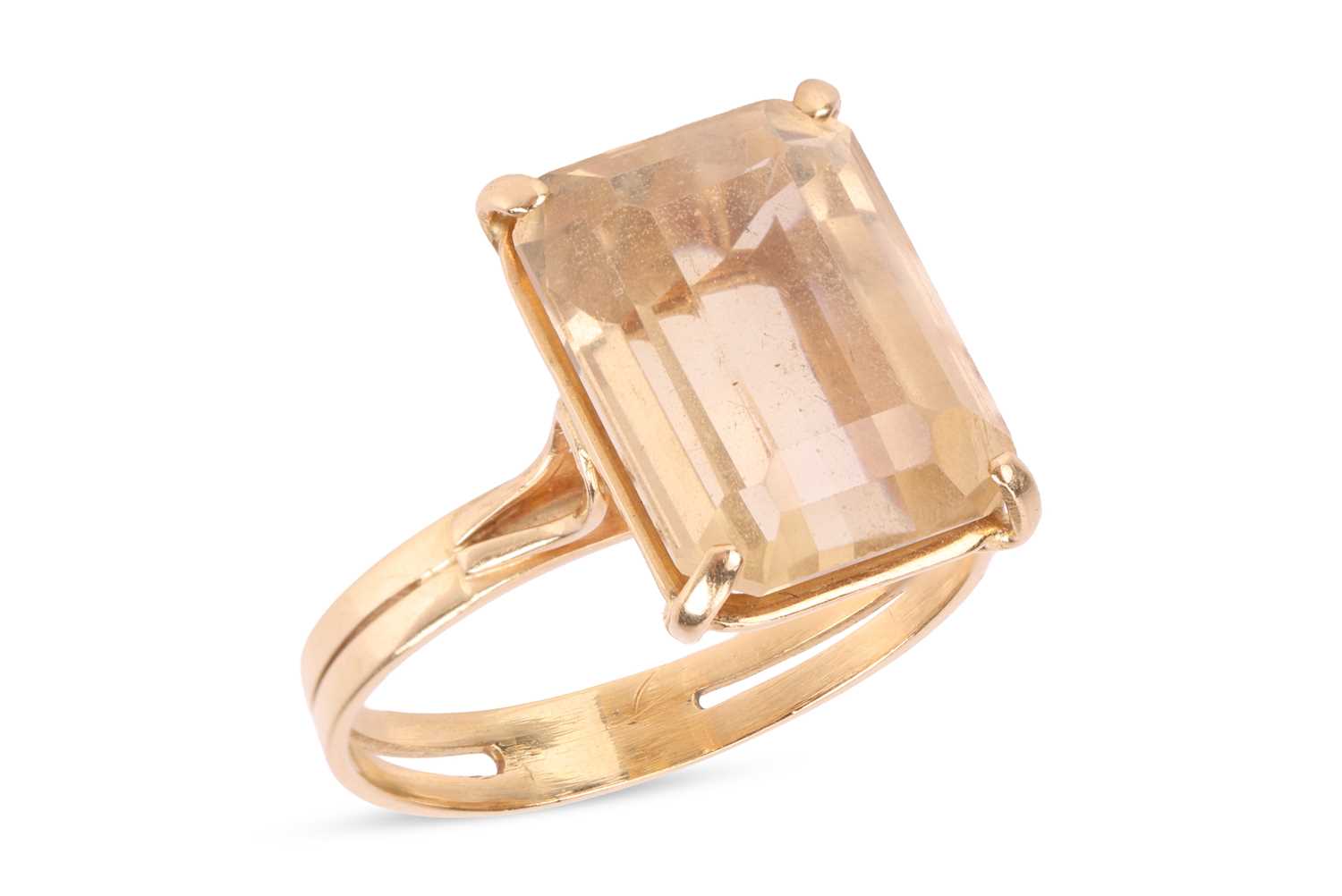 Lot A citrine dress ring, claw-set with a...
