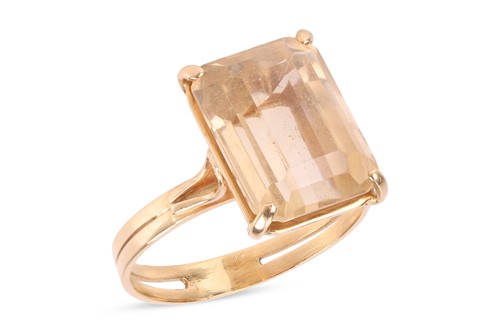 Lot A citrine dress ring, claw-set with a...