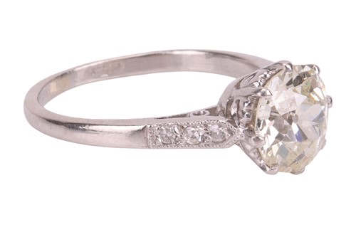 Lot A diamond solitaire ring, centred with a...