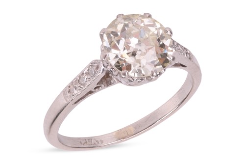 Lot A diamond solitaire ring, centred with a...