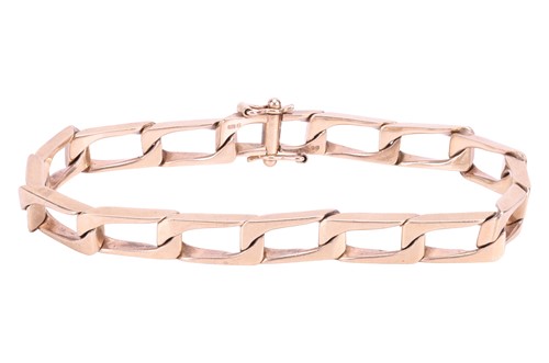 Lot A square curb link bracelet in 9ct gold,...