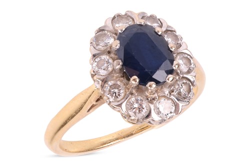Lot A sapphire and diamond cluster ring, the...