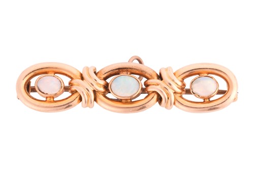 Lot An opal bar brooch, set with three oval...