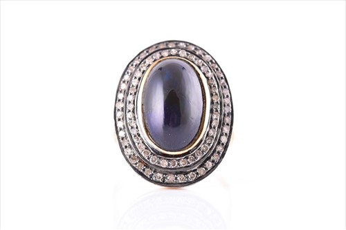 Lot 699 - A diamond and black opal cocktail ring set...